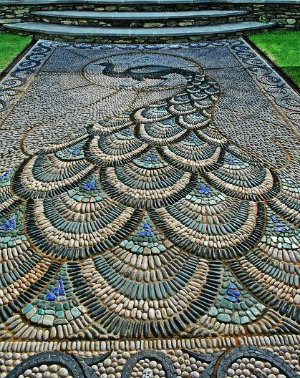 A path made of tiny stones dipicting a peacock